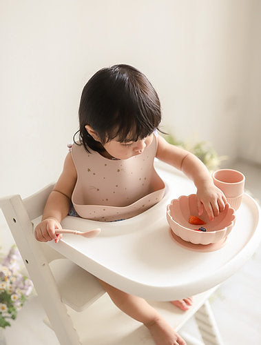 Kit & Kate Silicone Cup Bowl and Spoon Toddler and Baby Feeding Set in Pinkish for children learning how to eat and feed themselves at the table