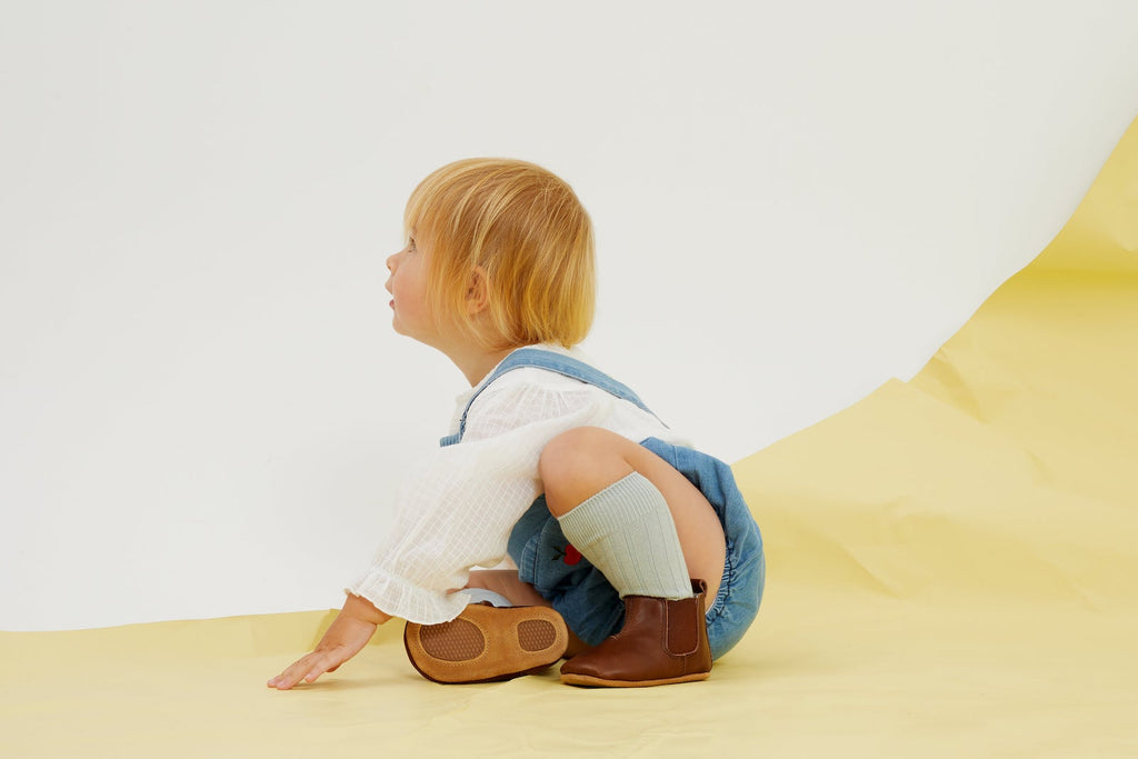 Quality leather baby shoes in the form of boots